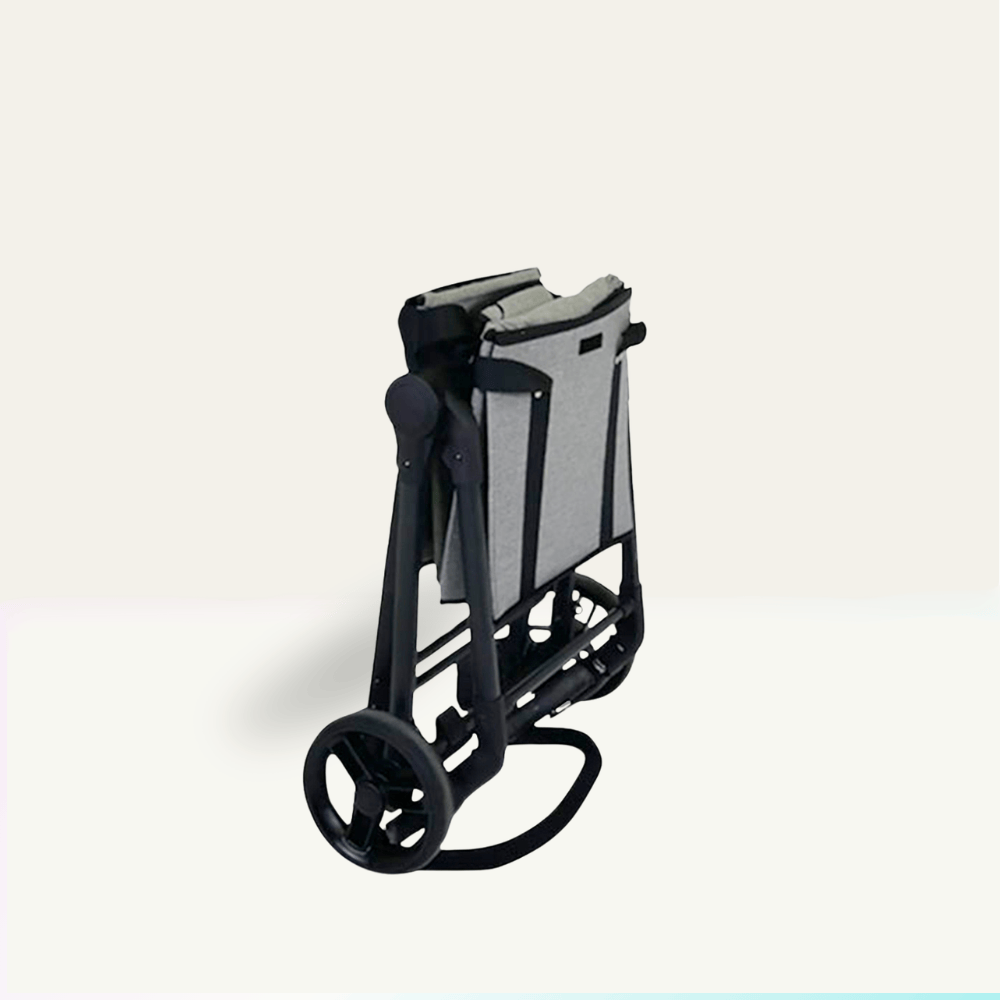 VOOMcart foldable and compact with folded bins and self-standing handlbar acting as kickstand on a light beige background