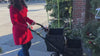 Stylish woman grocery shopping with VOOMcart easily loading and orgainizing